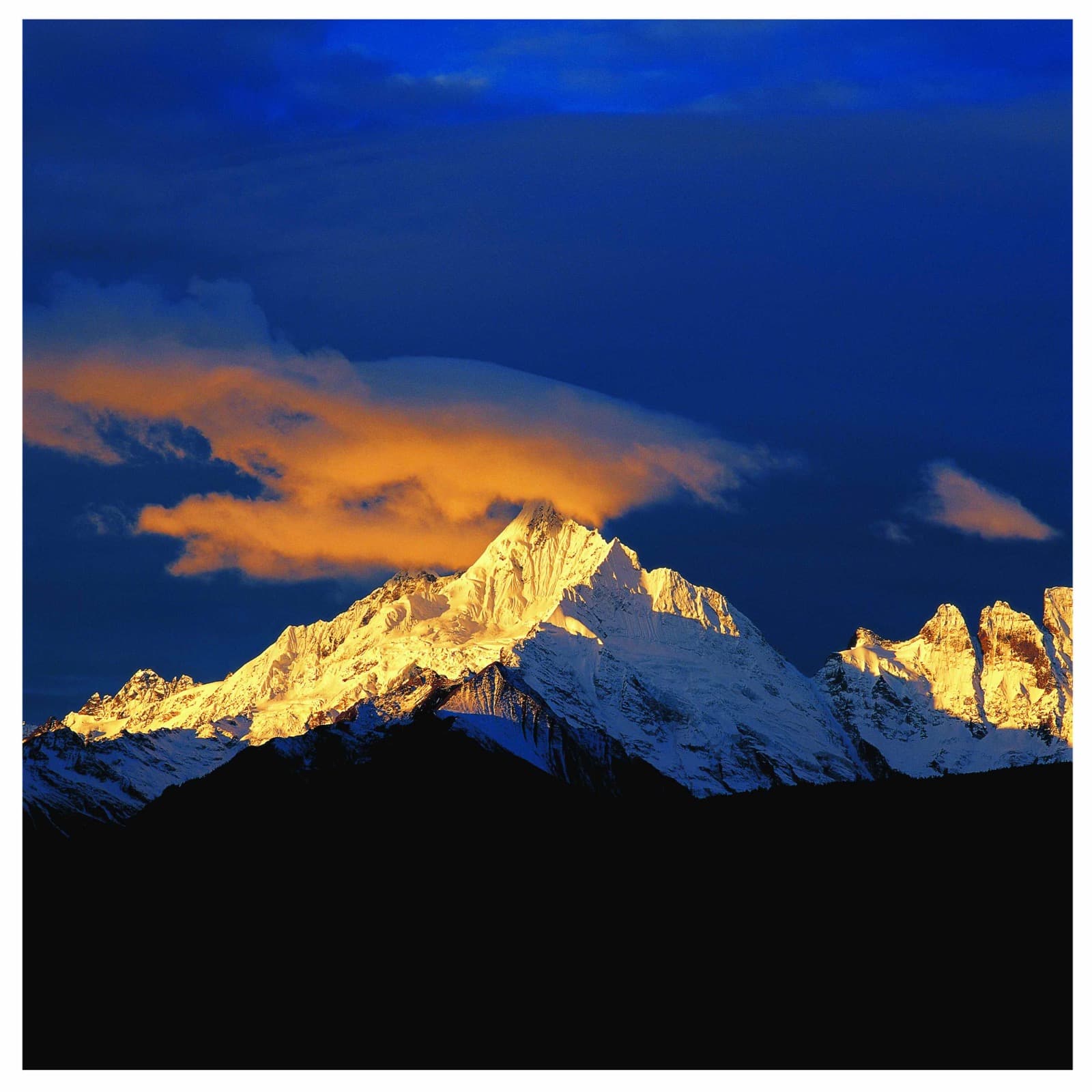 Golden sunset illuminating mountain peaks